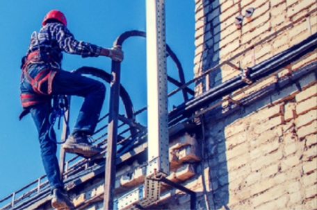 man climbing ladder to roof