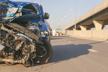 destroyed car on freeway