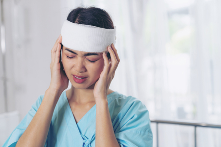woman in hospital with head injury