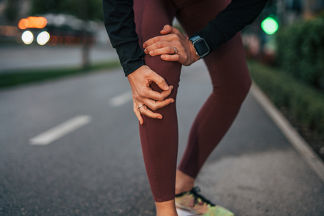 Woman experiencing knee pain